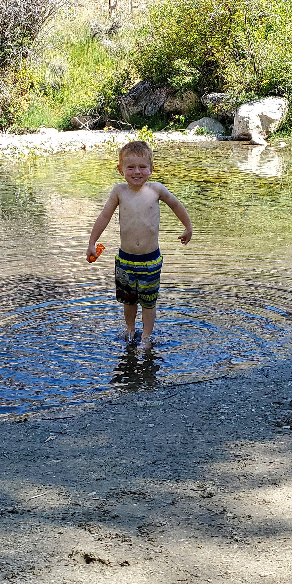 Kaasen is registered to the contest to win money with this photo: child, fun, joy, leisure, person, play, puddle, recreation, reflection, river, stream, summer, tree, vacation, water, water_resources, watercourse