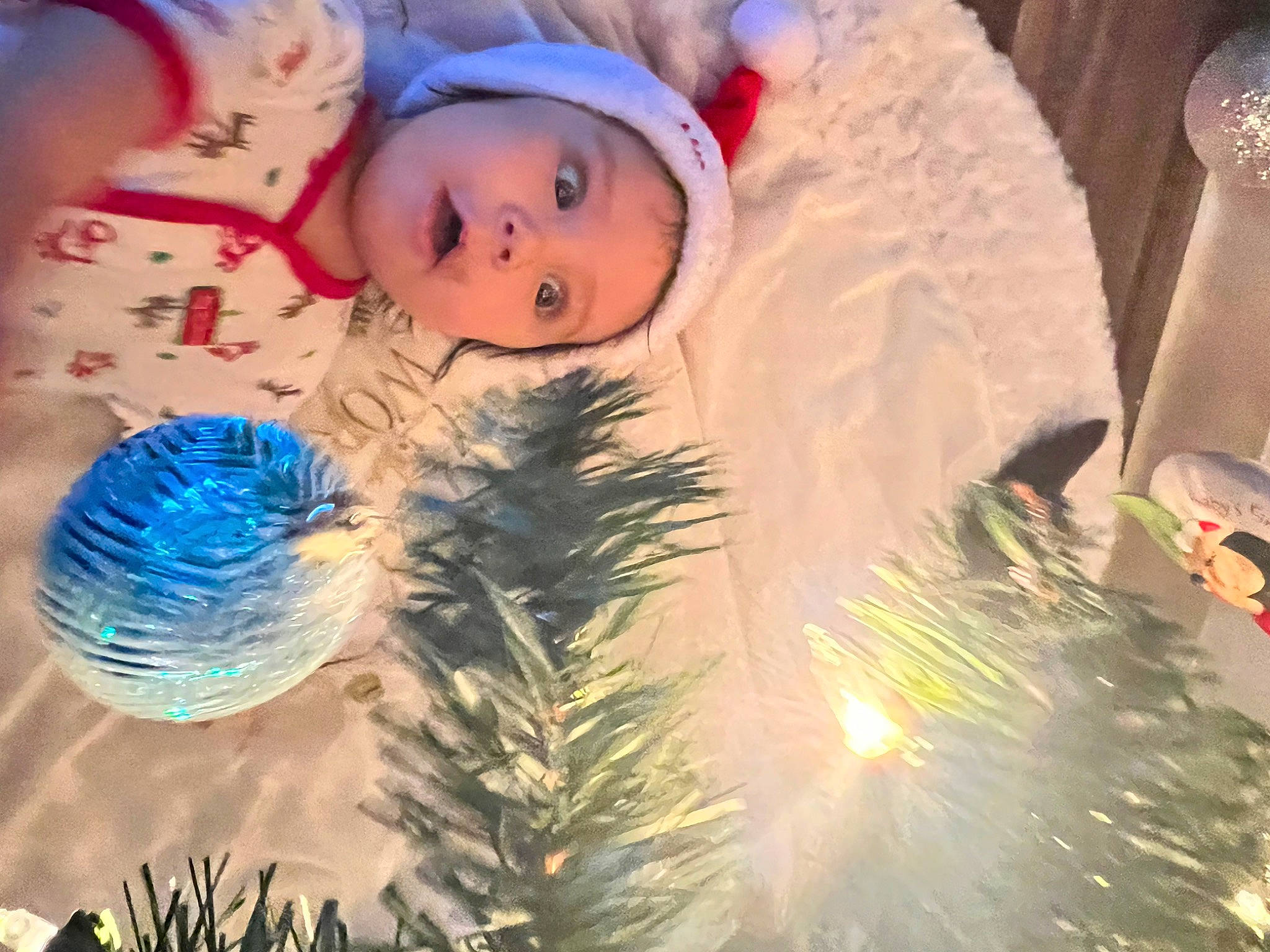 Kailani is registered to the contest to win money with this photo: christmas, christmas_decoration, christmas_eve, christmas_lights, christmas_ornament, christmas_tree, conifer, electric_blue, event, evergreen, glass, happy, headwear, holiday, holiday_ornament, interior_design, ornament, person, smile, surprise