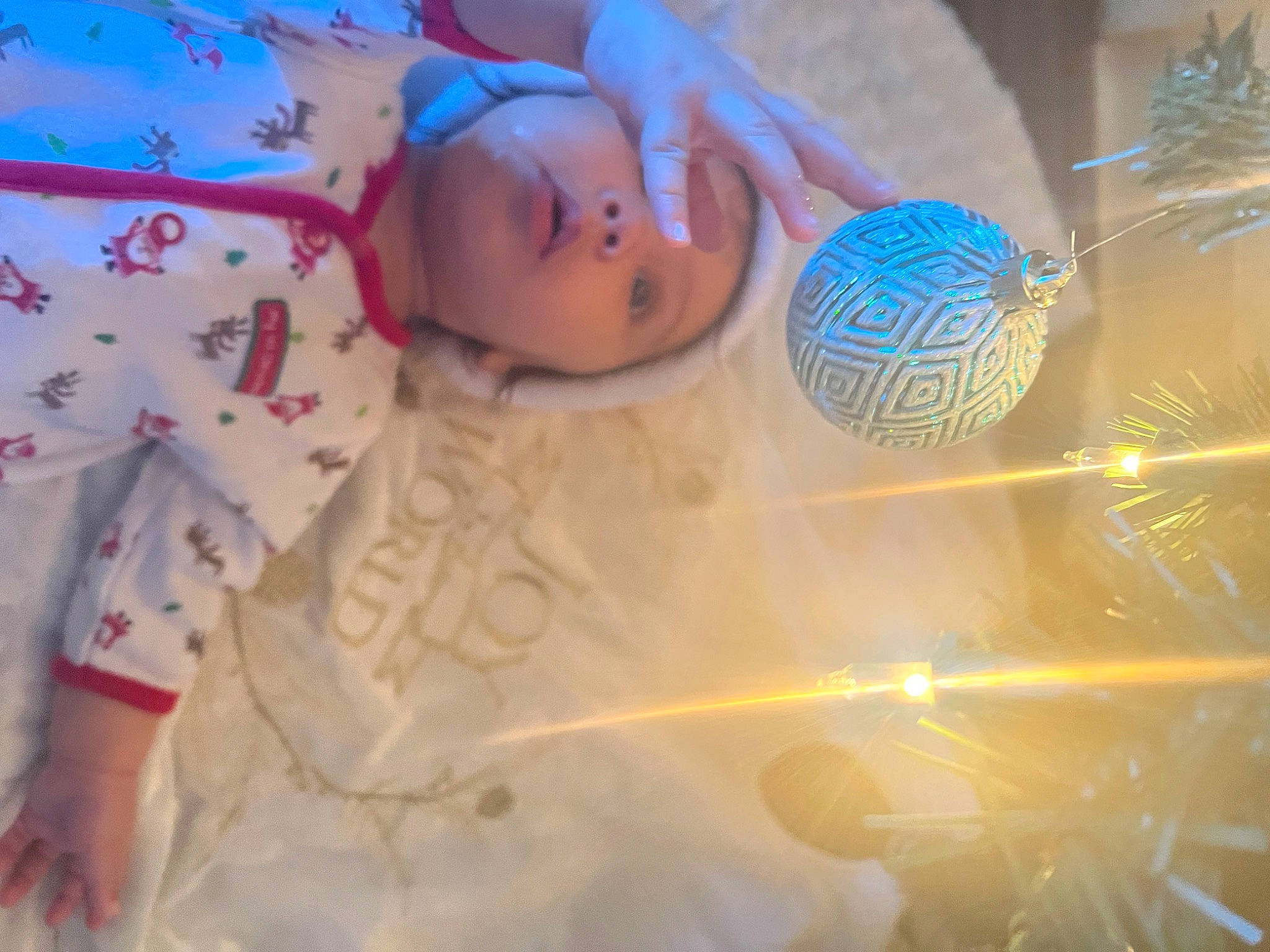 Kailani is registered to the contest to win money with this photo: automotive_lighting, baby, baby_products, child, doll, event, eyelash, glass, linens, pattern, person, petal, plastic, room, toddler, toy, transparent_material