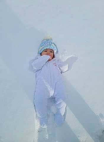 Willow is registered to the contest to win money with this photo: child, event, fashion_design, freezing, fur, glacial_landform, glove, happy, headwear, hoodie, ice_cap, jacket, landscape, people_in_nature, person, playing_in_the_snow, recreation, sleeve, slope, snow