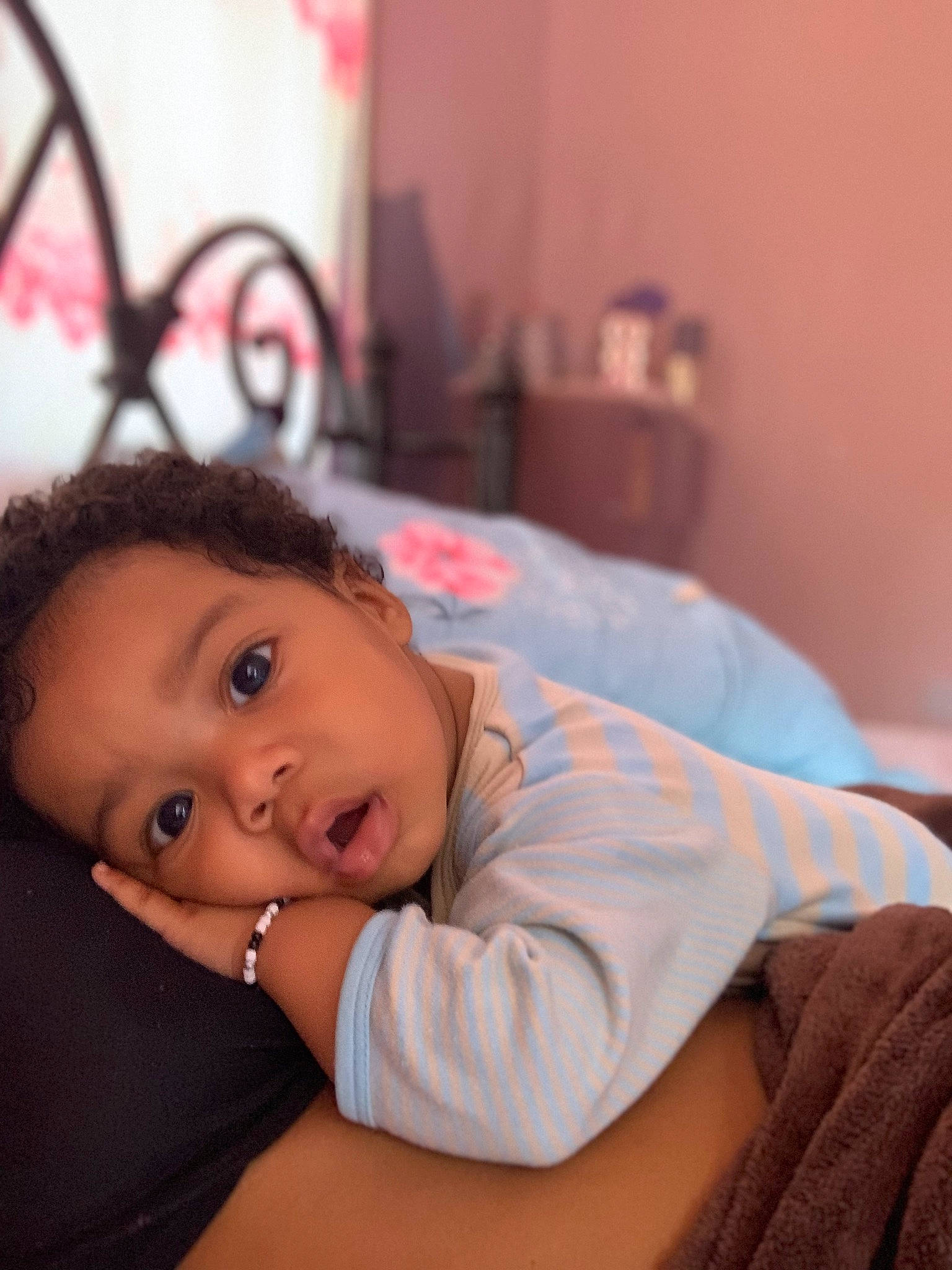 Andres is registered to the contest to win money with this photo: baby, bed, cheek, child, comfort, couch, eyelash, facial_expression, flash_photography, flooring, happy, iris, linens, lip, nose, person, portrait_photography, room, sitting, skin