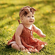 Mia is registered to the contest to win money with this photo: baby, child, girl, grass, outdoor, sunlight, dress, headband, bow, smiling, sitting, nature, greenery, flower, cute, portrait, happy, summer, infant, skin
