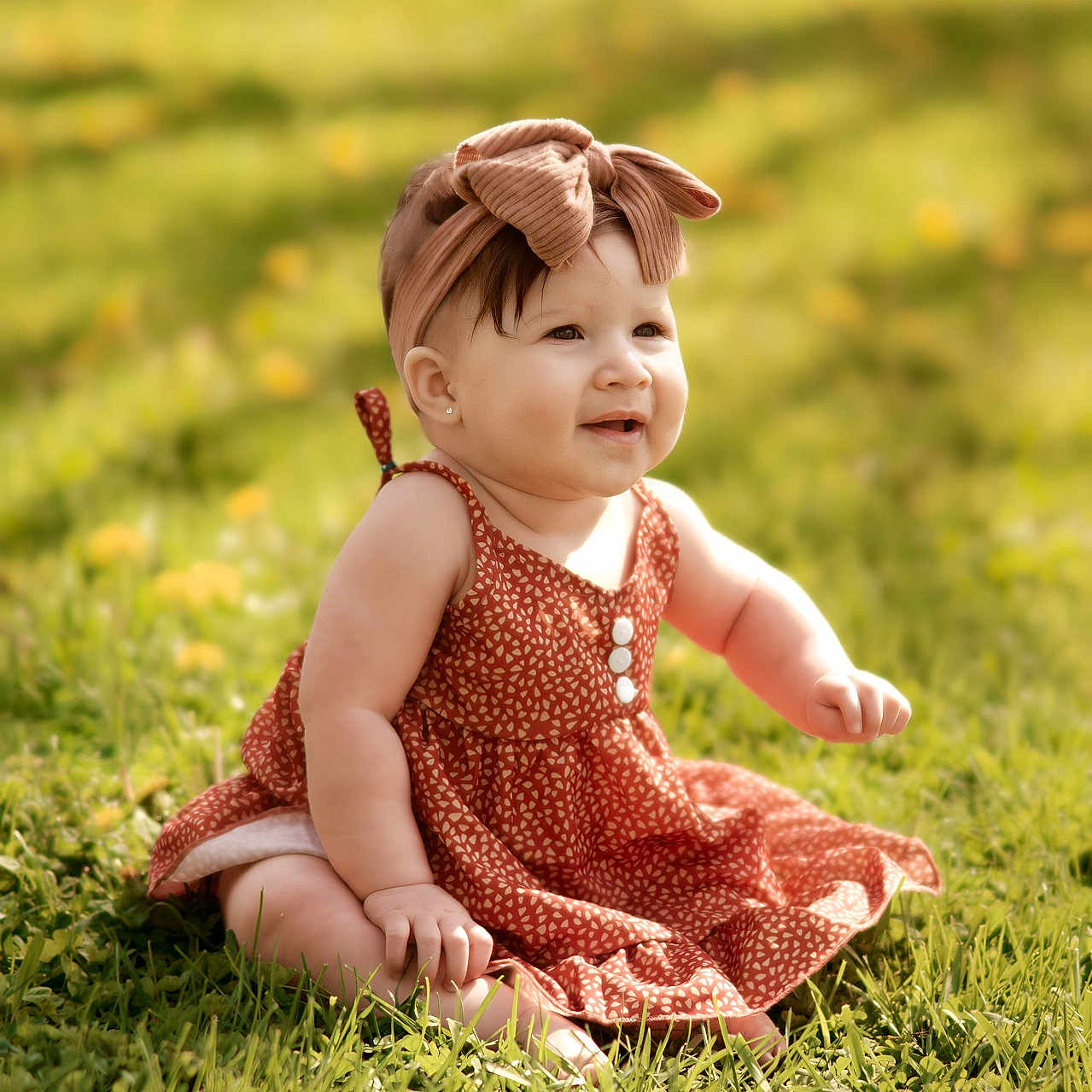 Mia is registered to the contest to win money with this photo: baby, child, girl, grass, outdoor, sunlight, dress, headband, bow, smiling, sitting, nature, greenery, flower, cute, portrait, happy, summer, infant, skin
