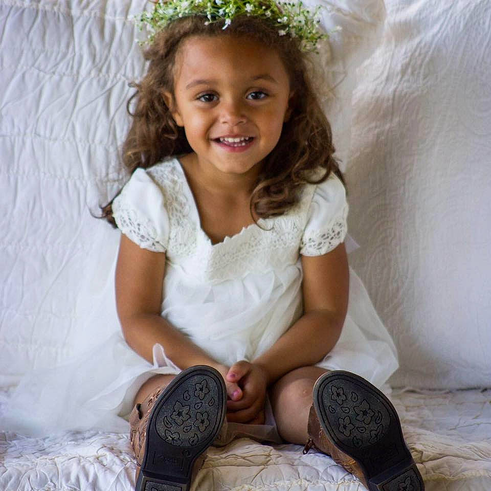 Makenzie joined the competition — help win amazing prizes! brown_hair, child, child_model, girl, hair_accessory, joy, person, sitting, smile, toddler