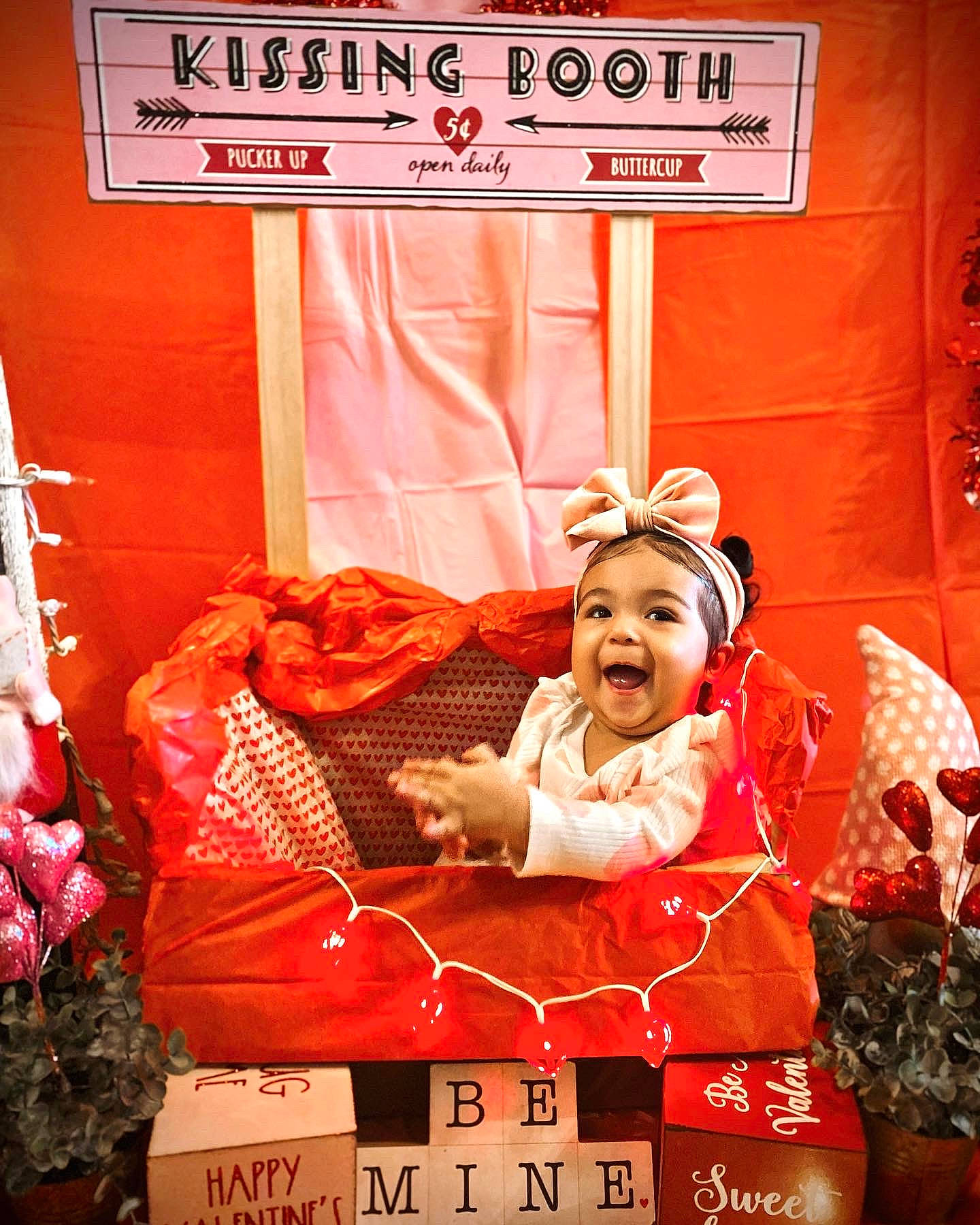Kahlani is registered to the contest to win money with this photo: advertising, carmine, event, font, happy, logo, luggage_and_bags, magenta, peach, person, pink, public_event, red, room, sitting, smile, toddler, vintage_clothing