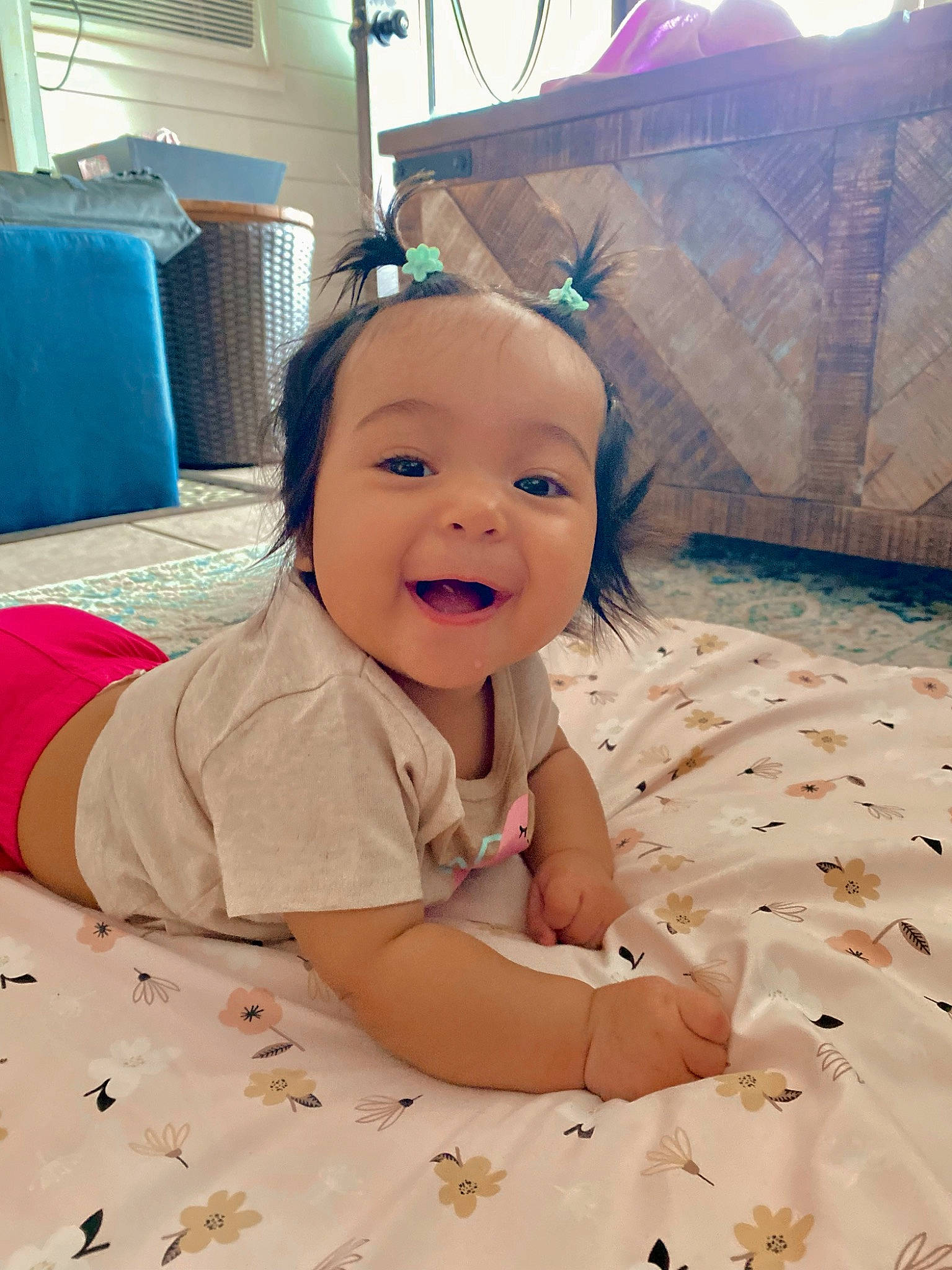 Kahlani joined the competition — help win amazing prizes! baby, baby_laughing, baby_toddler_clothing, cheek, child, comfort, crawling, floor, flooring, fun, happy, linens, person, pink, play, room, sitting, skin, smile, toddler