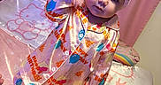 Bayleigh is registered to the contest to win money with this photo: bed, bedding, birthday_theme, blanket, child, clothing, curtain, cute, foot, headband, hello_kitty, indoors, pajamas, person, pink, portrait, silky, soft, standing, toddler