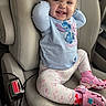 toddler, child, car_seat, smiling, happy, blue_shirt, stitch_character, floral_leggings, pink_crocs, minnie_mouse, car_interior, seatbelt_buckle, cute, casual_clothing, footwear, sitting, portrait, young_child, playful, joyful