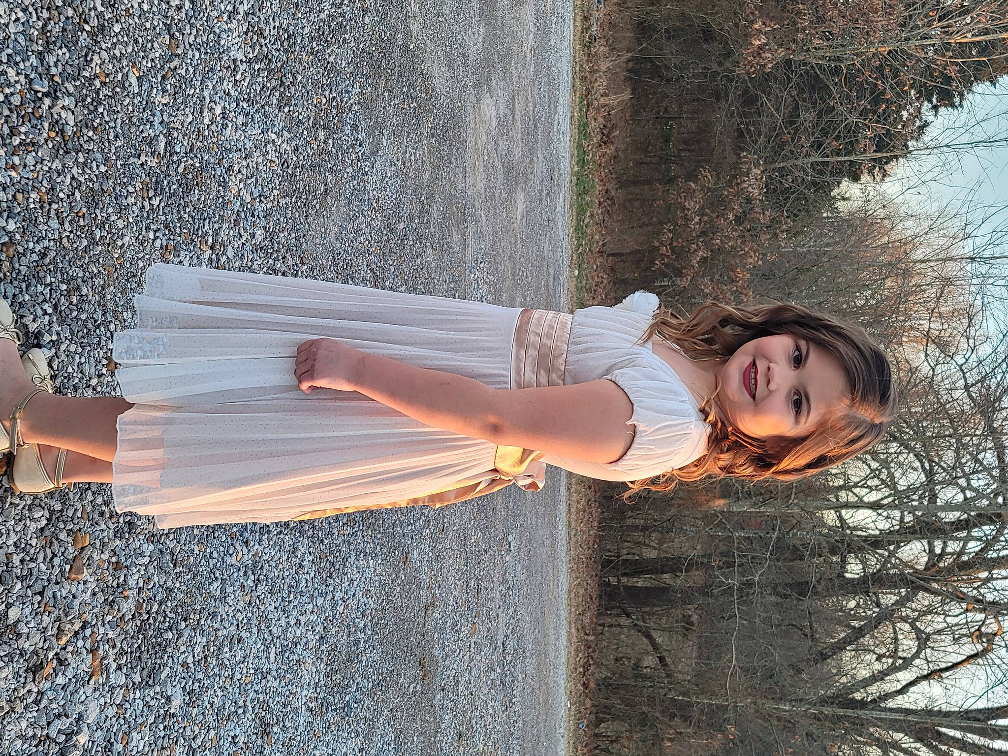 Ella is registered to the contest to win money with this photo: dress, elbow, flash_photography, fun, grass, hairstyle, happy, human_leg, joy, leisure, people_in_nature, person, smile, sunlight, thigh, tints_and_shades, tree, waist, water, window