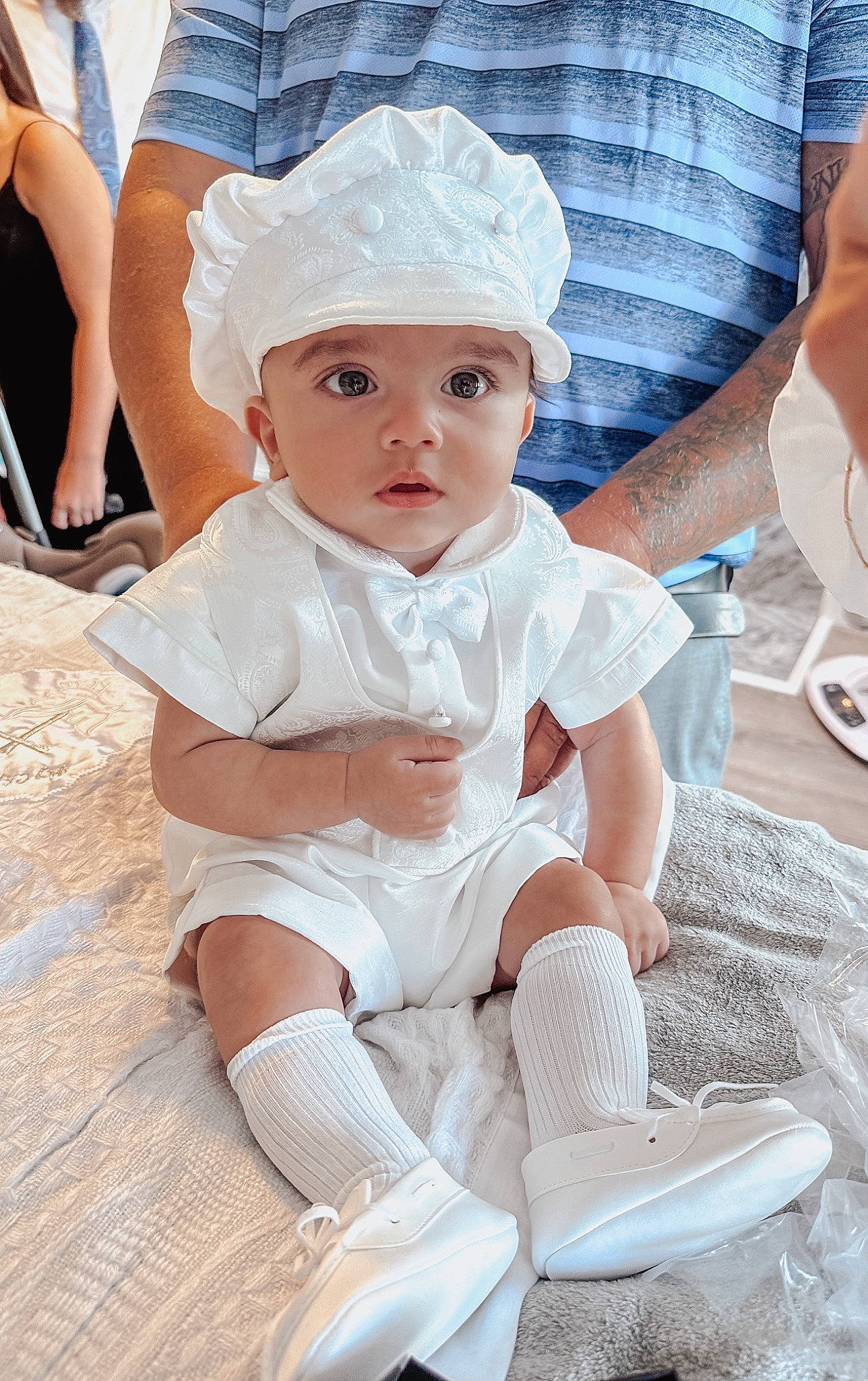 Carmine is registered to the contest to win money with this photo: baby, baby_products, baby_toddler_clothing, cap, chair, cheek, child, fashion_accessory, fun, happy, headwear, human_leg, knee, pattern, person, pink, sitting, skin, sock, thigh