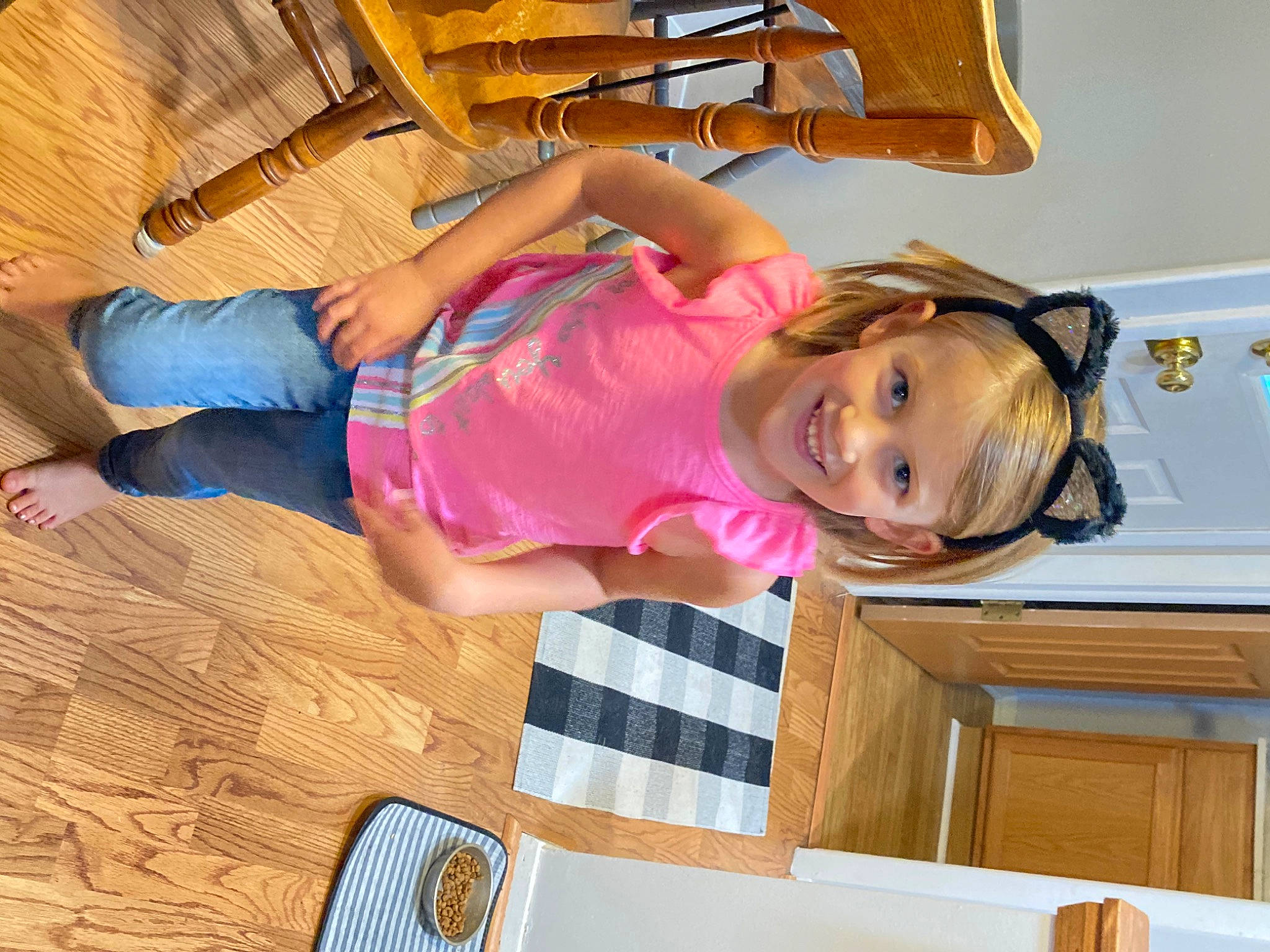 Jane is registered to the contest to win money with this photo: baby_toddler_clothing, child, comfort, drawer, eyewear, flooring, fun, happy, hardwood, joy, leisure, magenta, organ, person, room, smile, t_shirt, thigh, toddler, varnish