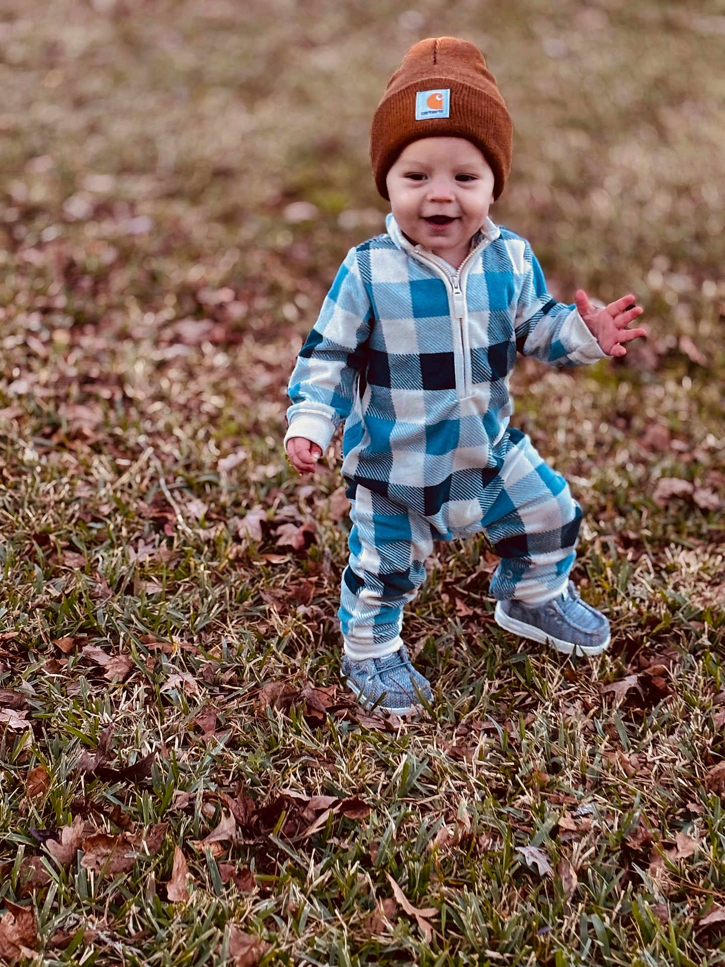 Khoen is registered to the contest to win money with this photo: toddler, child, baby, outdoor, grass, leaves, autumn, clothing, hat, beanie, footwear, shoes, plaid, smile, happy, person, walking, nature, young, seasonal