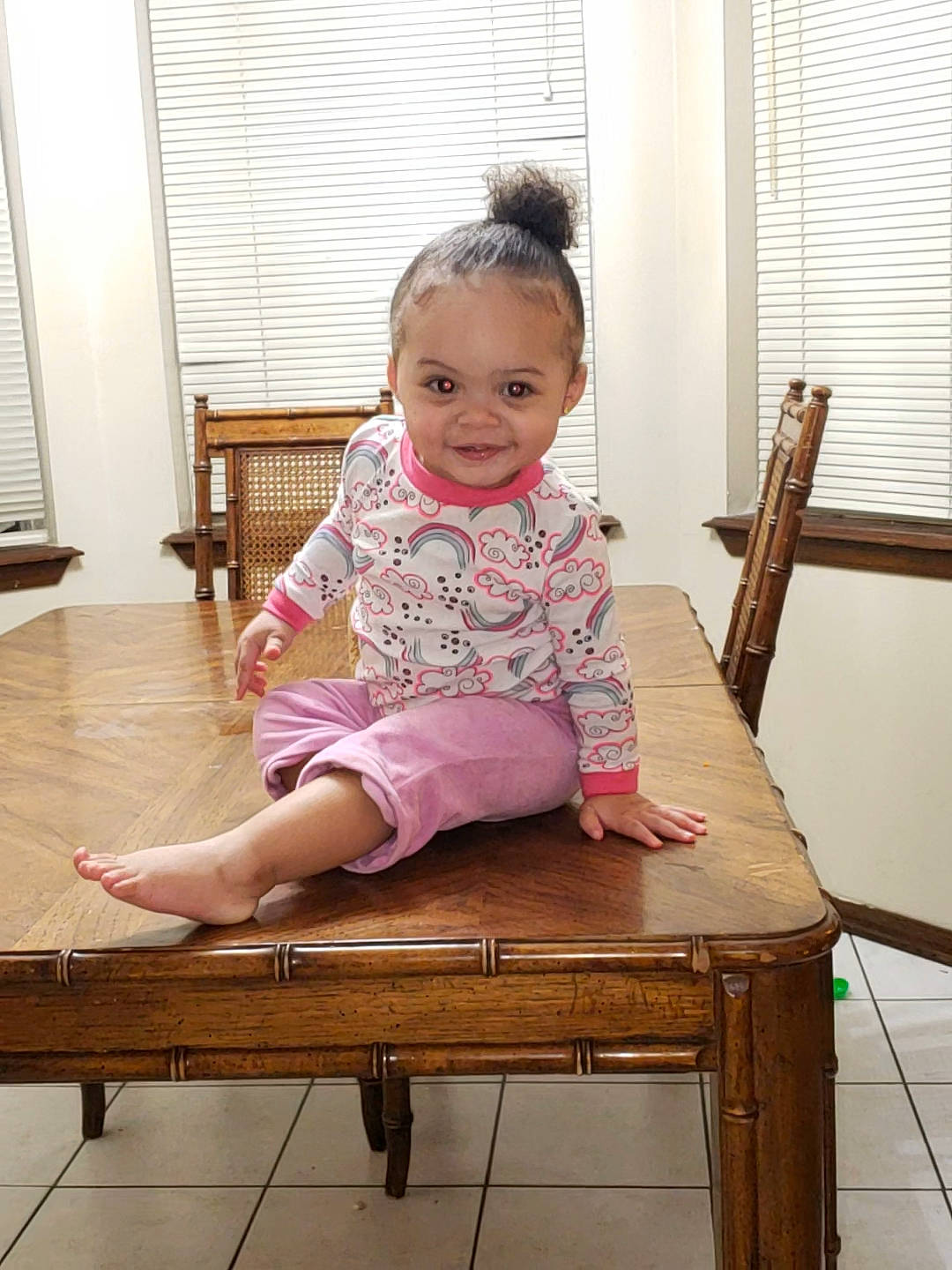 Aminah is registered to the contest to win money with this photo: chair, child, furniture, person, sitting, table, toddler