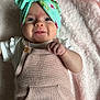 Addison is registered to the contest to win money with this photo: baby, infant, smiling, headband, knitted_overall, pink_blanket, happy, cute, portrait, child, clothing, texture, soft, cozy, lying_down, closeup, indoors, skin, face, hand