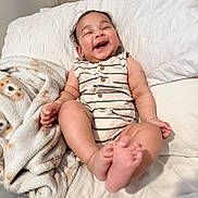 Ryan joined the competition — help win amazing prizes! baby, laughing, smiling, bed, blanket, infant, happy, cute, child, face, feet, clothing, striped, buttoned, soft, cozy, indoor, person, toddler, resting