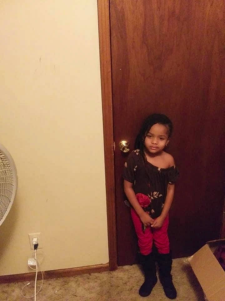 Jakayla is registered to the contest to win money with this photo: child, floor, flooring, fun, hardwood, home_door, human_leg, knee, leg, long_hair, magenta, mechanical_fan, person, room, shorts, sleeve, standing, thigh, toddler, waist