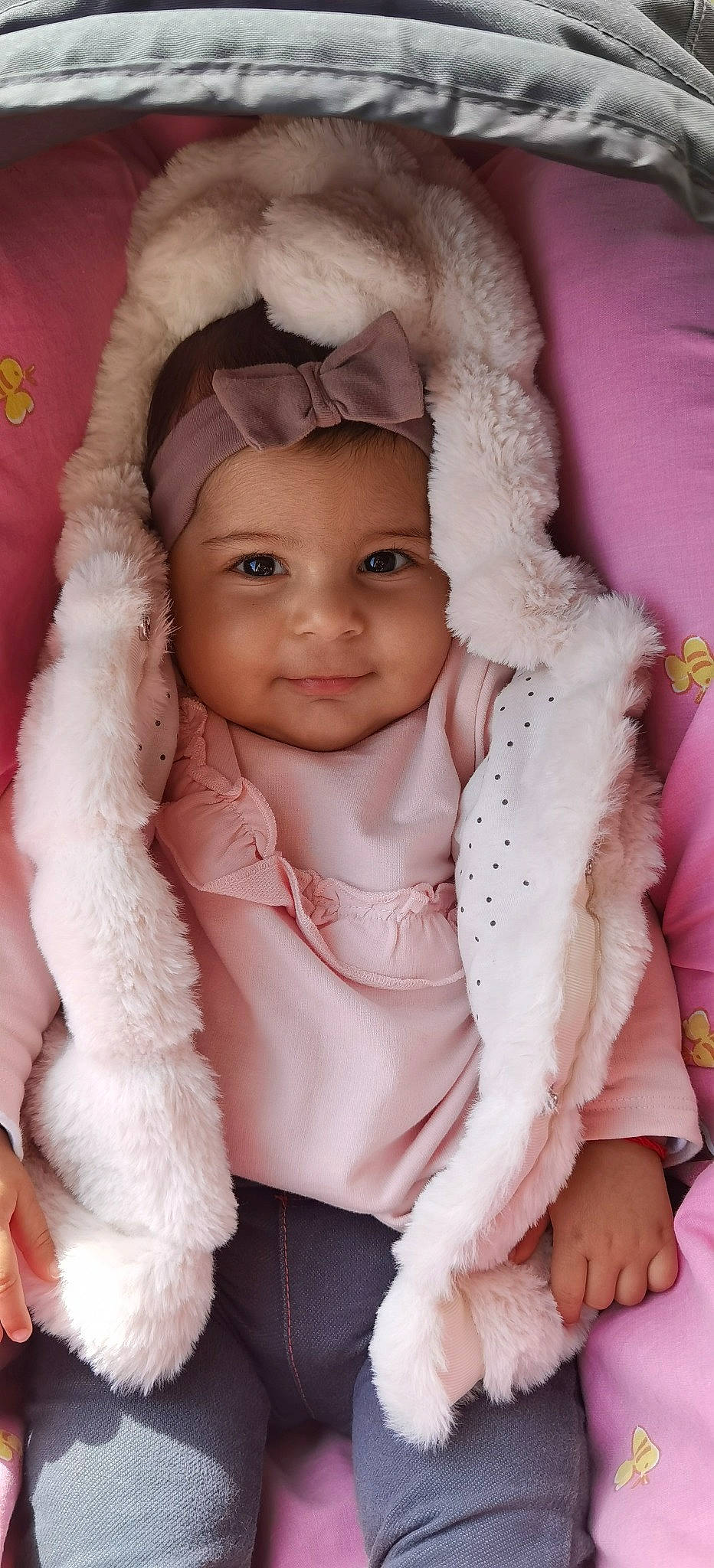 Angela Staneva participe au concours pour gagner de l'argent avec cette photo : baby_toddler_clothing, cap, cheek, ear, eye, eyebrow, eyelash, fur_clothing, gesture, happy, head, headgear, headwear, iris, lip, neck, nose, person, pink, skin