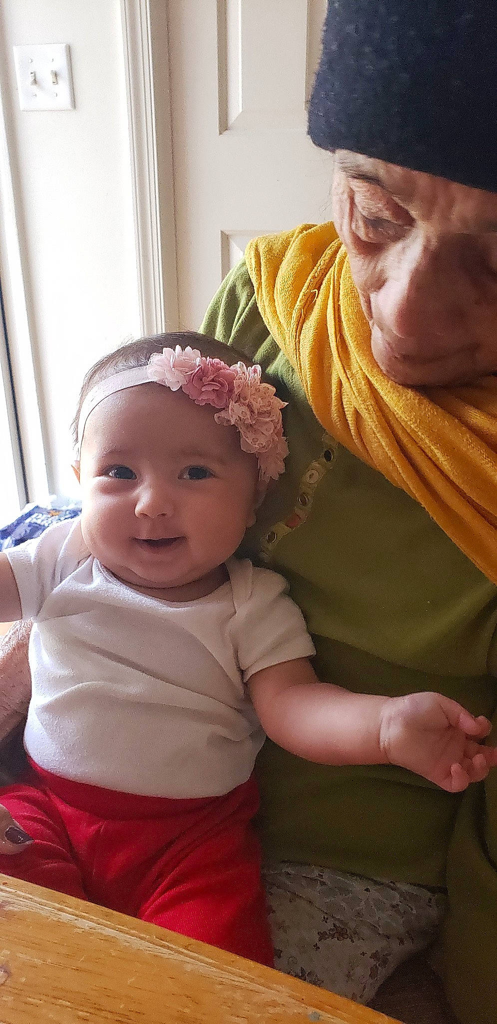 Marie is registered to the contest to win money with this photo: baby, bonnet, cheek, child, hair_accessory, headband, headgear, mother, person, skin, toddler