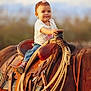 accessories, animal, baby, clothing, colthorse, equestrian, face, hat, head, helmet, horse, pants, person, photography, portrait, rodeo, rope, saddle, strap, sunhat
