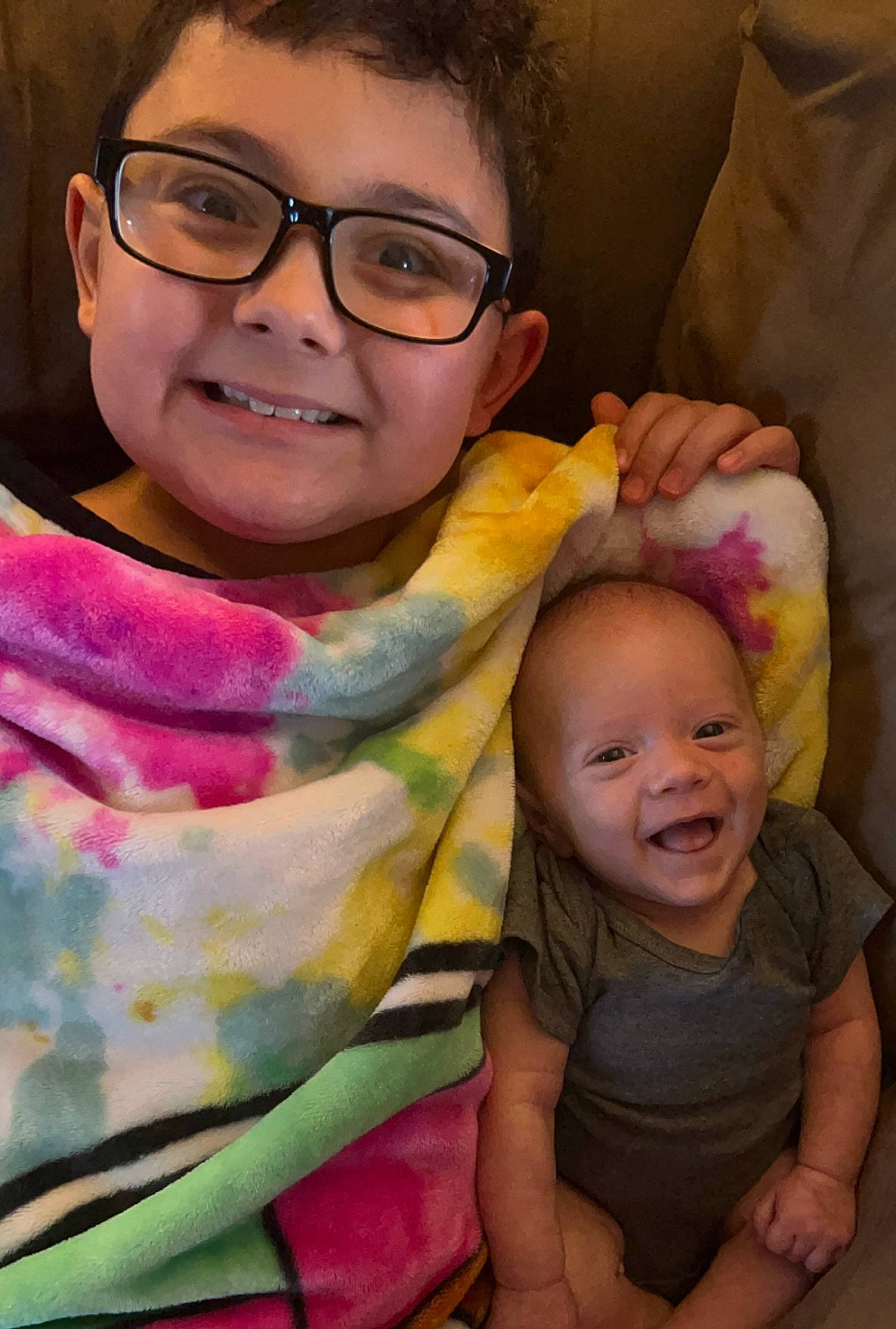 Camdyn is registered to the contest to win money with this photo: arm, cheek, chin, eye, face, facial_expression, forehead, glasses, hairstyle, head, human, human_body, joy, lip, mouth, nose, organ, person, photograph, skin