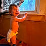 Xander Rebel is registered to the contest to win money with this photo: baby, child, curtain, diaper, face, furniture, hand, happy, home, indoor, light, pattern, person, playmat, room, smiling, standing, toddler, wall, window