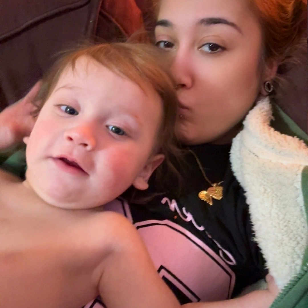 Xander Rebel joined the competition — help win amazing prizes! adult, affection, blanket, casual, child, closeup, couch, cozy, face, family, hair, indoor, jacket, kiss, love, person, portrait, relaxed, skin, warm_clothing