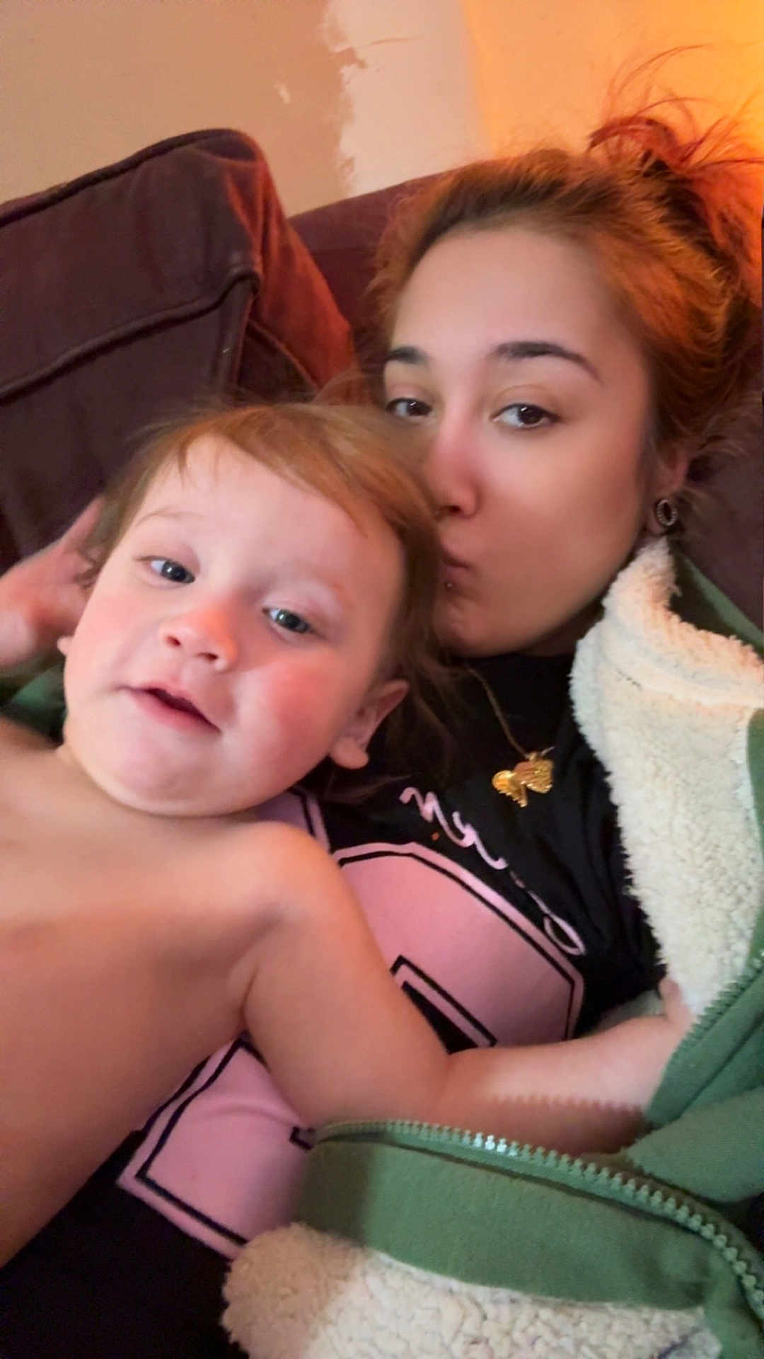 Xander Rebel joined the competition — help win amazing prizes! child, adult, couch, kiss, cozy, indoor, family, warm_clothing, blanket, portrait, closeup, casual, relaxed, love, affection, person, face, hair, jacket, skin