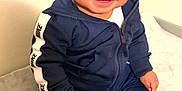Syaire joined the competition — help win amazing prizes! toddler, child, smiling, sitting, nike, tracksuit, sneakers, clothing, footwear, happy, indoor, person, cute, baby, casual, portrait, fashion, young_child, apparel, feet