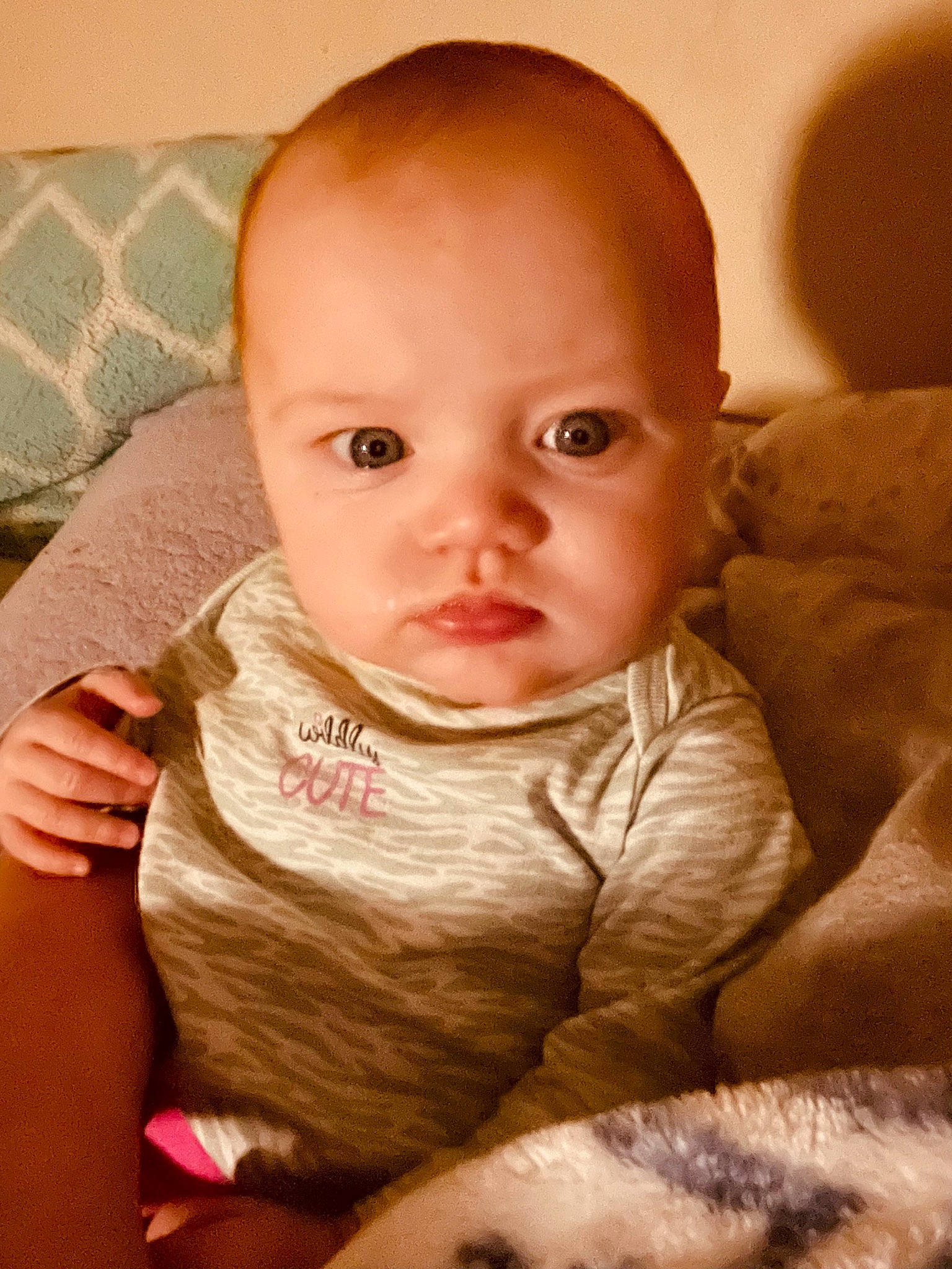 Octavia is registered to the contest to win money with this photo: baby, baby_toddler_clothing, cheek, child, comfort, eyelash, happy, linens, lip, nail, nose, person, sitting, skin, sleeve, thumb, toddler