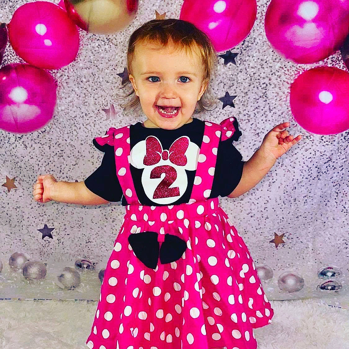 Azlynn joined the competition — help win amazing prizes! baby_toddler_clothing, balloon, child, clothing, dress, facial_expression, happy, magenta, one_piece_garment, pattern, person, photograph, pink, purple, red, sleeve, smile, standing, toddler, violet