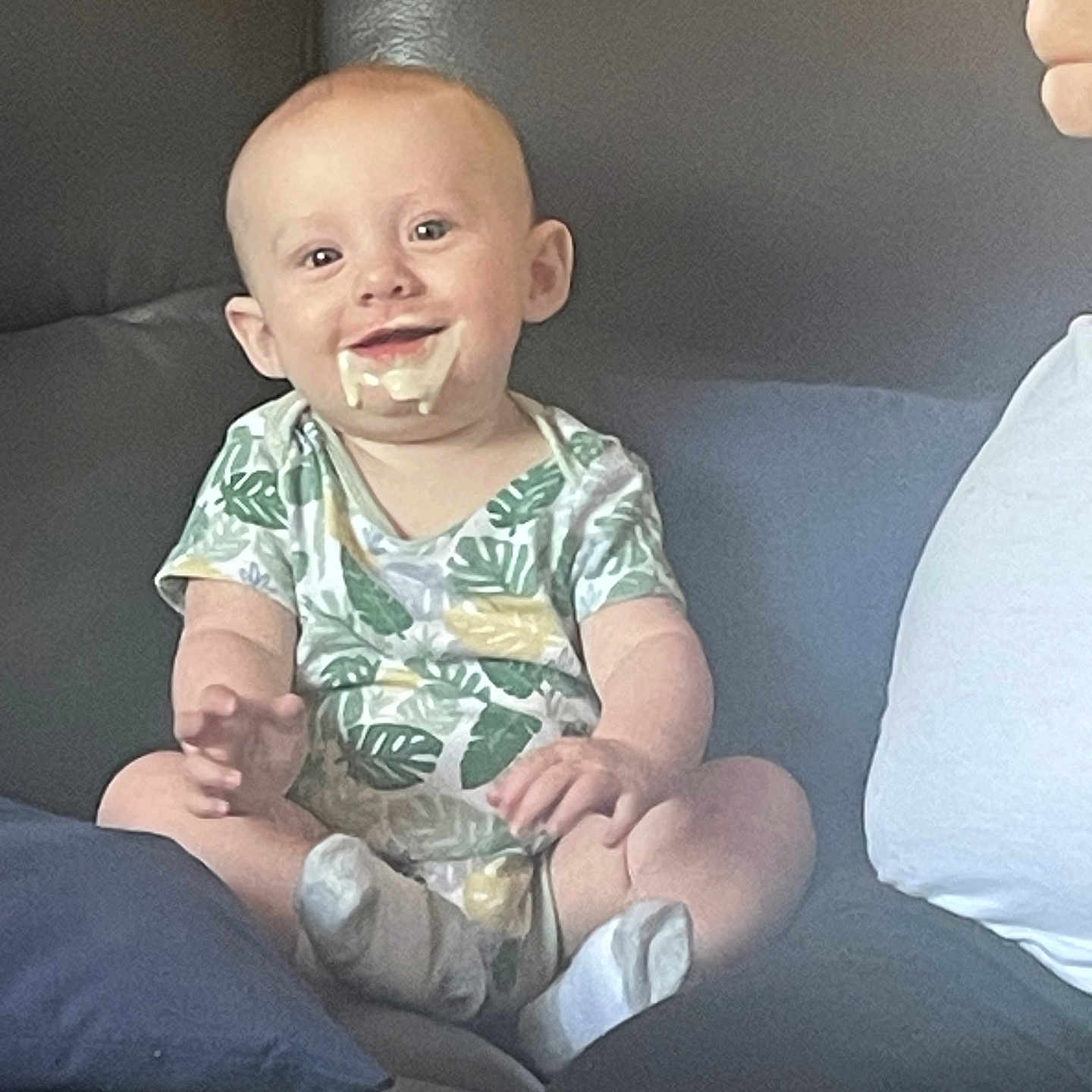 Clive is registered to the contest to win money with this photo: baby, babylaughing, clothing, couch, cream, cushion, cutlery, dessert, face, food, furniture, happy, head, homedecor, icecream, person, photography, portrait, spoon, t_shirt