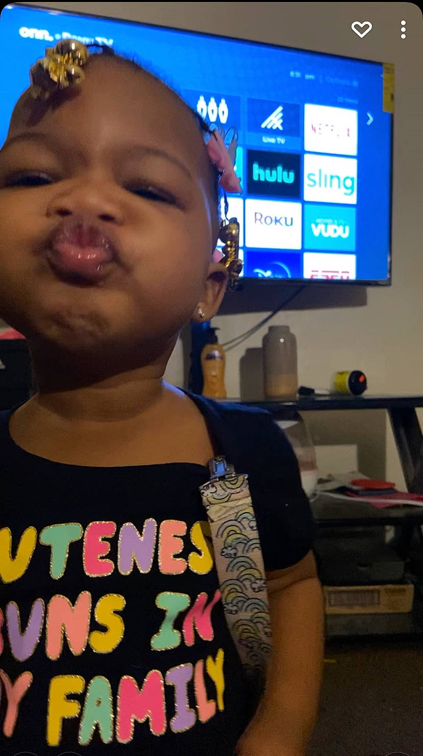 Alaysia is registered to the contest to win money with this photo: audio_equipment, baby, blue, cool, design, electric_blue, eyelash, eyewear, finger, fun, gadget, happy, neck, peripheral, person, sleeve, standing, t_shirt, television, toddler