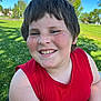 blue_sky, casual_clothing, cheerful, child, closeup, daylight, face, freckles, grass, happy, nature, outdoor, park, person, portrait, red_shirt, smiling, summer, sunny, trees