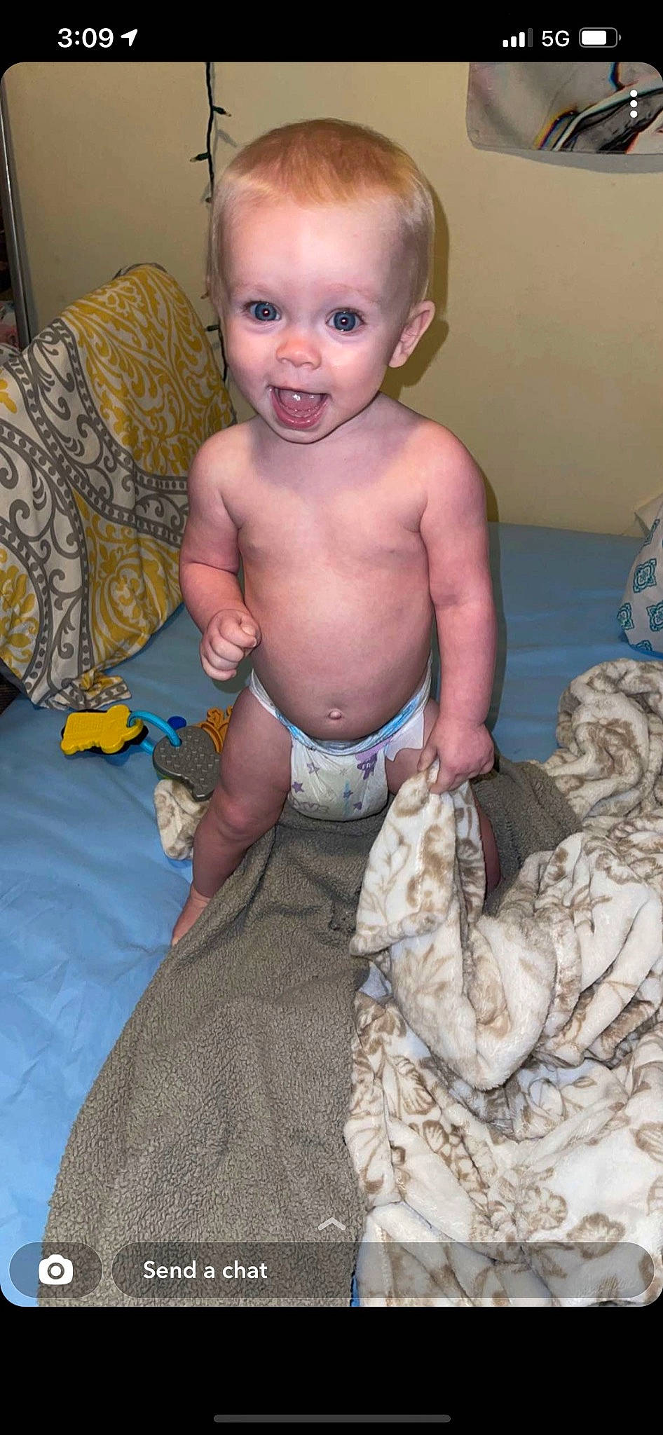 Lakelynn is registered to the contest to win money with this photo: abdomen, baby, baby_toddler_clothing, barechested, cheek, chest, child, comfort, face, flooring, fun, head, linens, pattern, person, room, sitting, smile, thumb, toddler