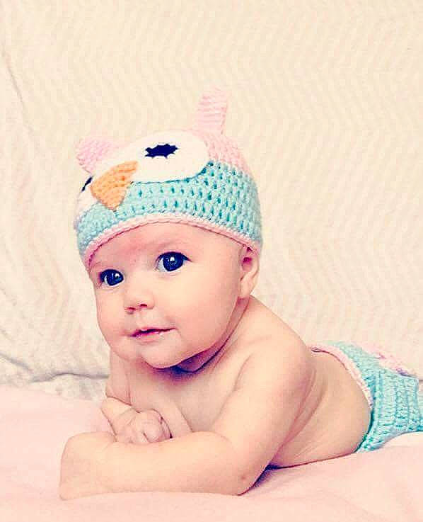 Allie is registered to the contest to win money with this photo: cap, child, clothing, face, fashion_accessory, hair_accessory, head, headgear, infant, pattern, pink, sun_hat, toddler