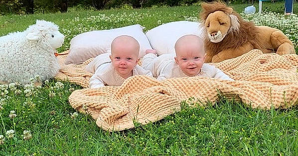 Oliver And Everett joined the competition — help win amazing prizes! baby, baby_toddler_clothing, comfort, eye, face, facial_expression, fun, grass, happy, head, interaction, mammal, people_in_nature, person, plant, playing_with_kids, skin, smile, toddler, vertebrate