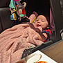 baby, blanket, car_seat, chicken_wings, child, colorful, cozy, cute, face, food, happy, indoor, infant, pink, plate, rolls, smile, soft, table, toy
