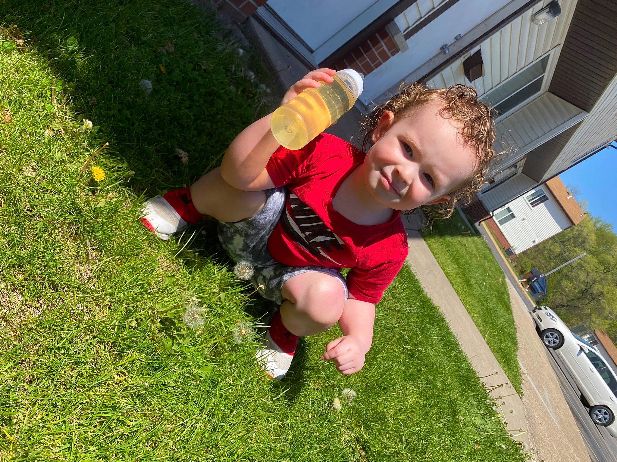 Zayvier joined the competition — help win amazing prizes! automotive_exterior, car, family_car, fun, grass, hood, human_leg, joy, knee, lawn, leisure, motor_vehicle, person, plant, recreation, shorts, sneakers, sports_equipment, t_shirt, thigh