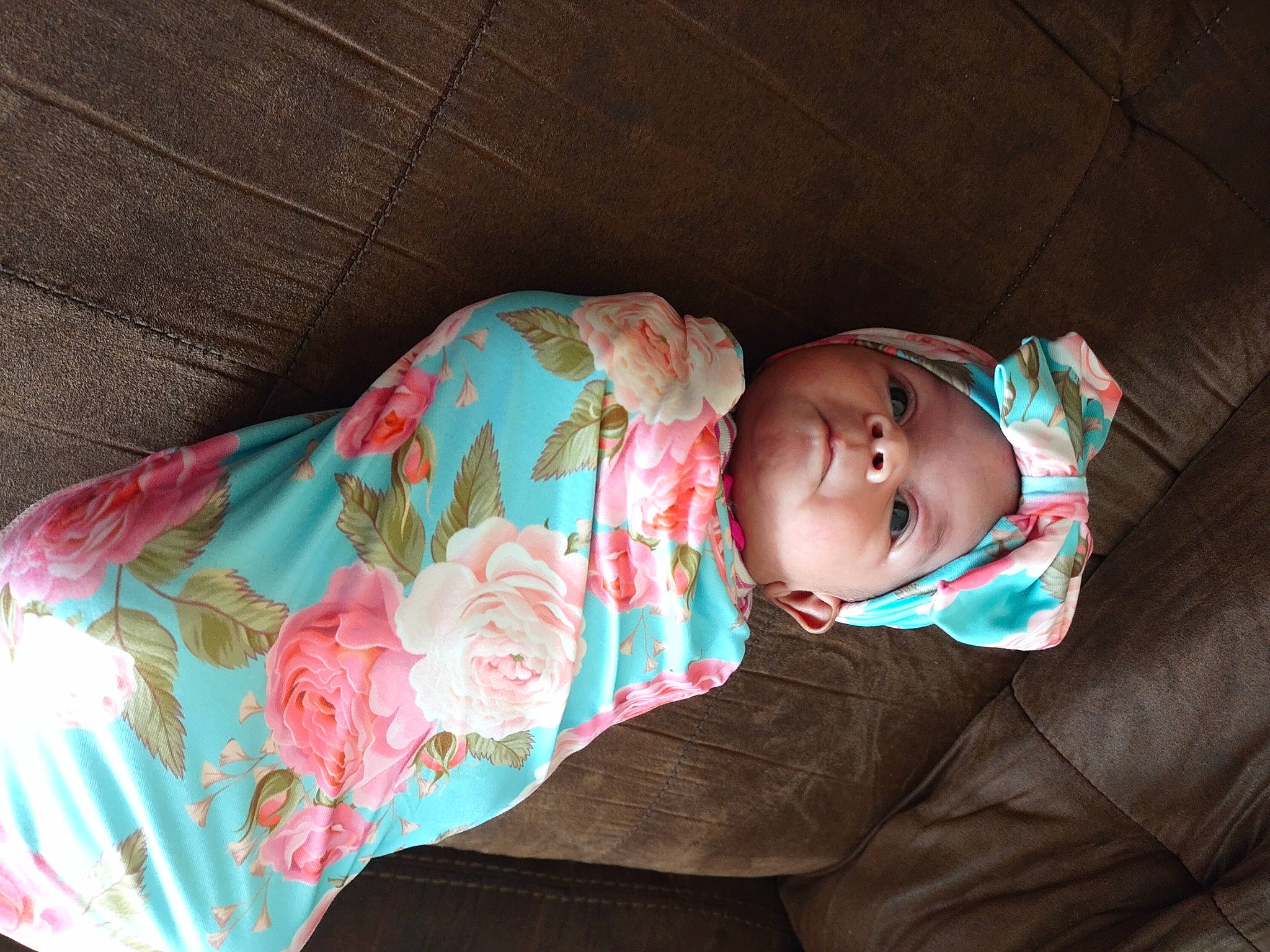 Ari is registered to the contest to win money with this photo: baby, baby_toddler_clothing, cheek, child, comfort, dress, eye, head, headgear, headwear, human_body, iris, jacket, lip, nose, outerwear, person, product, skin, sleeve