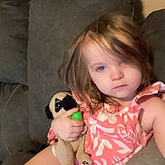 Iris joined the competition — help win amazing prizes! toddler, child, plush_toy, pug, couch, diaper, pink_top, indoor, relaxed, blue_eyes, brown_hair, casual, furniture, home, person, comfort, sitting, soft_toy, expressionless, living_room