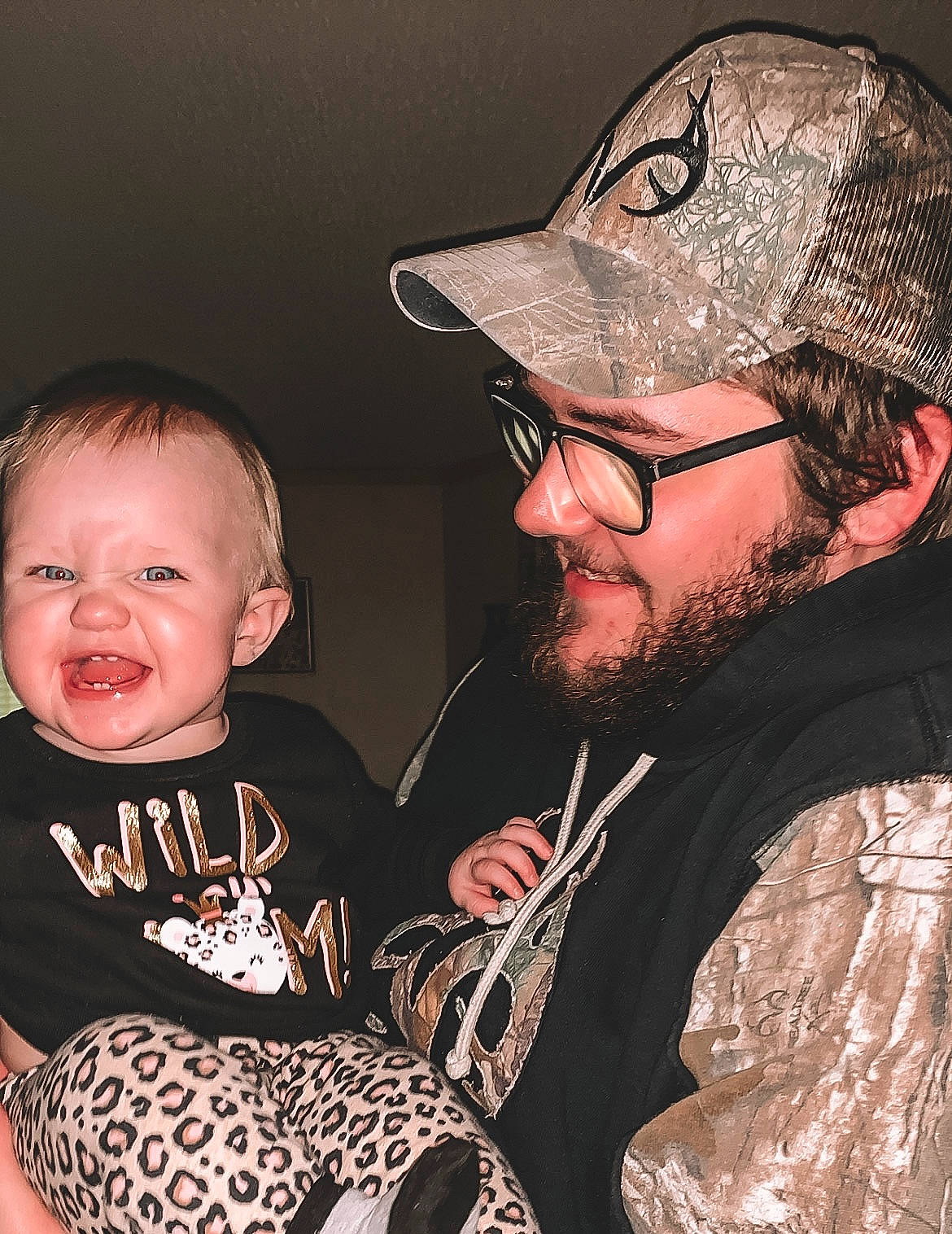 Chevelle is registered to the contest to win money with this photo: baby, baby_toddler_clothing, baseball_cap, beard, cap, cheek, cool, costume_accessory, eyewear, facial_hair, headwear, jacket, lip, love, mammal, moustache, mouth, nose, person, tongue