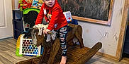 Memphis joined the competition — help win amazing prizes! animal, blackboard, boy, canine, chair, child, clothing, face, furniture, hardwood, head, indoors, interiordesign, male, pants, person, sitting, stainedwood, table, wood