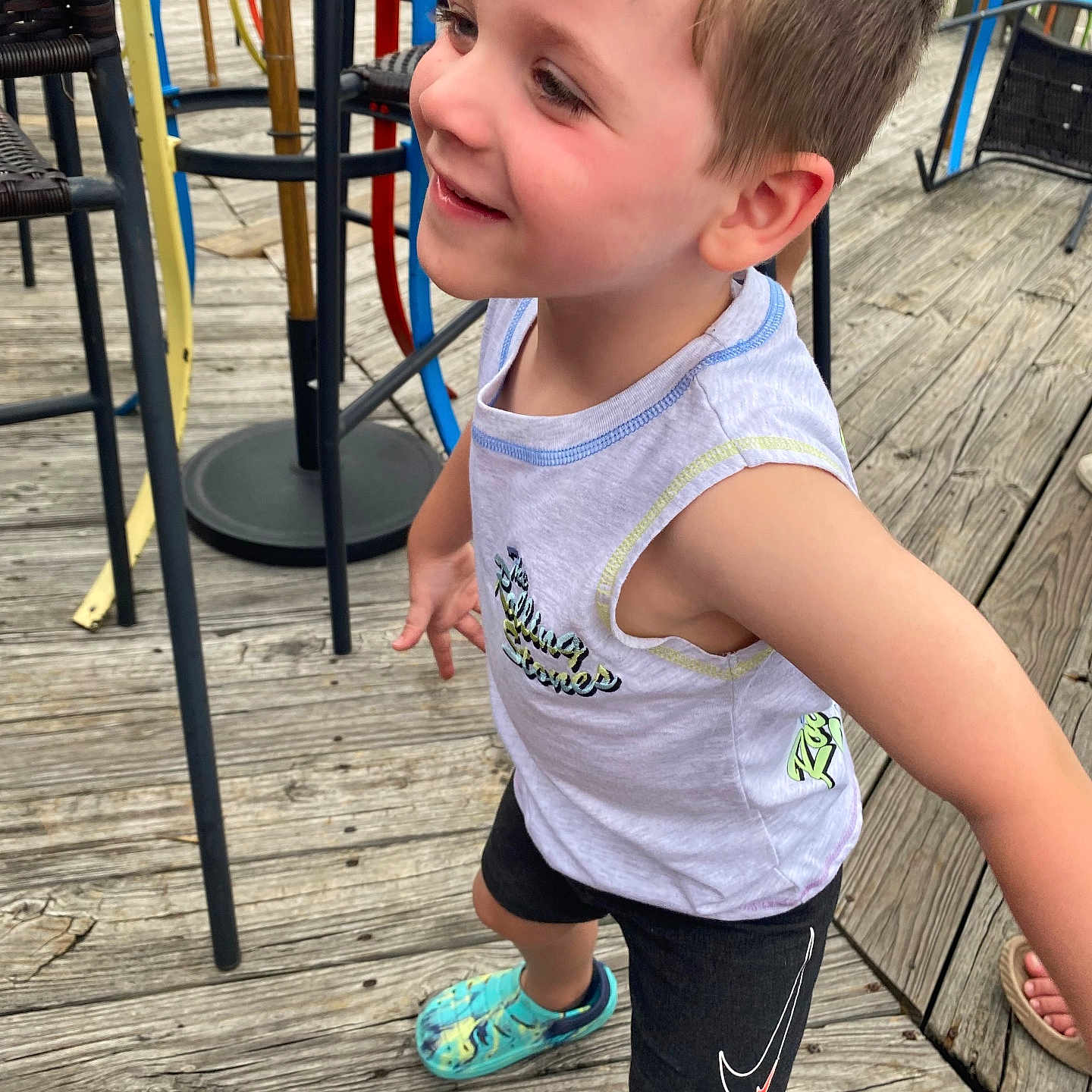 Memphis is registered to the contest to win money with this photo: active, boy, casual_clothing, child, colorful_shoes, cute, daylight, fun, happy, outdoor, person, playful, playground, portrait, shorts, sleeveless_shirt, smiling, summer, wooden_deck, young