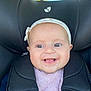 baby, child, car_seat, headband, smile, happy, infant, seatbelt, closeup, face, cute, safety, child_seat, portrait, clothing, person, young, indoors, baby_girl, seat