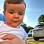 Pierre a rejoint le concours — aidez-le/la à gagner de superbes lots ! child, toddler, baby, face, portrait, outdoor, daylight, hand, smartwatch, watch, car, parking_lot, grass, tree, sky, cloud, person, clothing, expression, holding