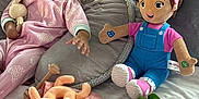 Bella joined the competition — help win amazing prizes! baby, bed, blanket, child, cozy, cushion, cute, happy, indoor, infant, pillow, pink_pajamas, playtime, plush_toy, reaching, sleepwear, smiling, soft_toys, stuffed_animal, toddler