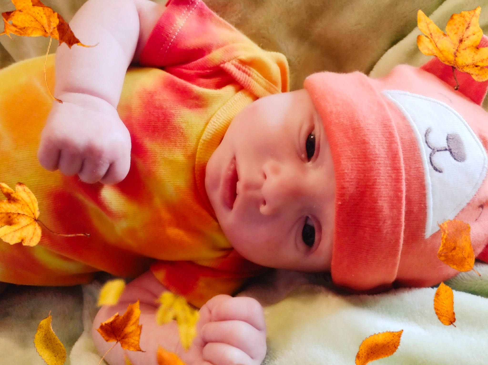 Evander is registered to the contest to win money with this photo: baby, baby_products, baby_toddler_clothing, cheek, child, event, eye, happy, hat, head, headwear, mammal, nose, orange, person, pink, room, skin, textile, toddler