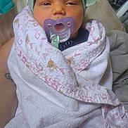Marie is registered to the contest to win money with this photo: baby, infant, child, portrait, pacifier, blanket, swaddled, hat, bow, knitted, face, eyes, indoors, bed, bedding, cozy, cute, sitting, textile, photography