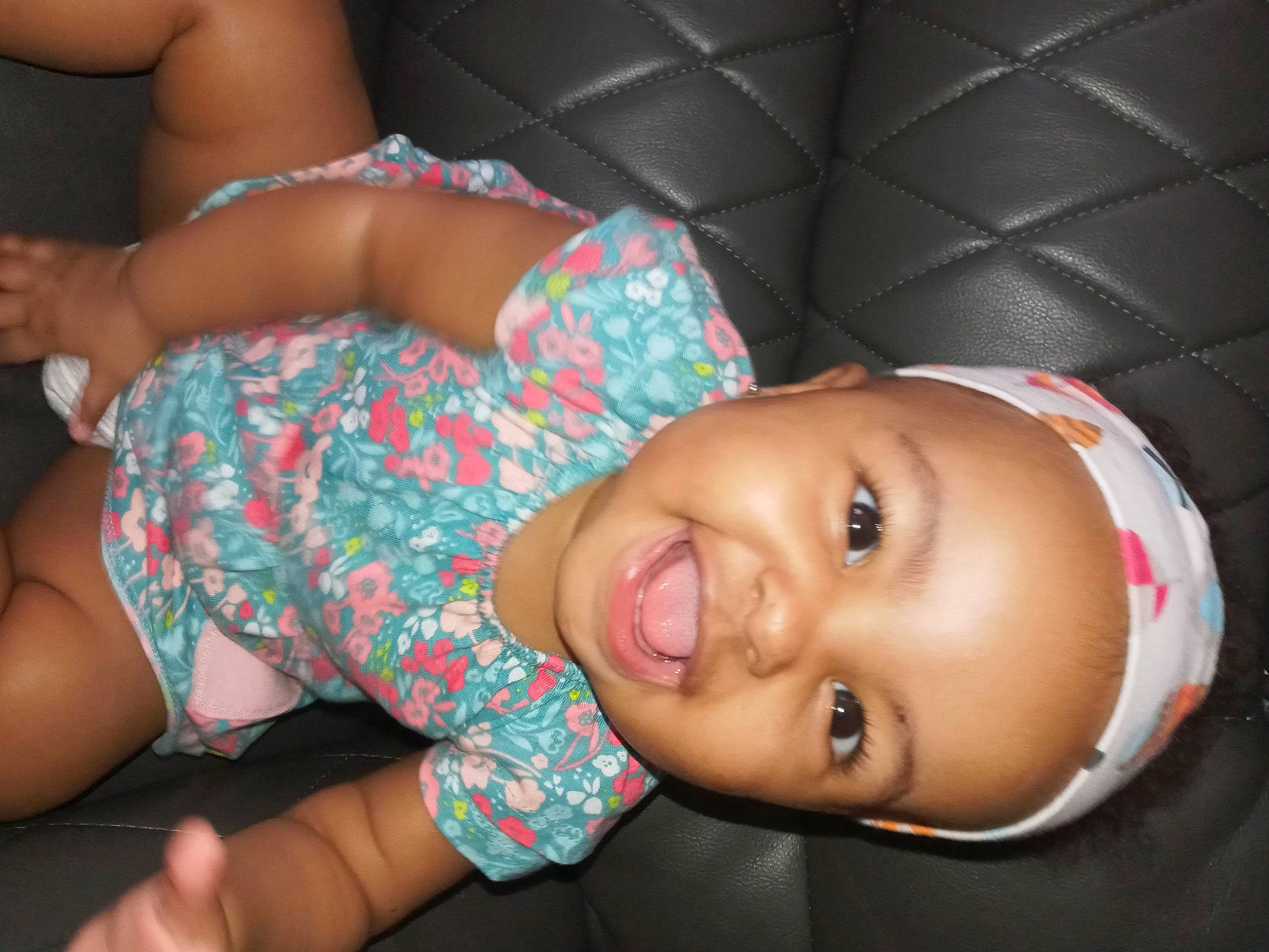 Ariyah is registered to the contest to win money with this photo: arm, baby_toddler_clothing, black_hair, elbow, eyelash, finger, fun, happy, headwear, human_body, joint, joy, lip, mouth, muscle, nose, organ, person, pink, skin