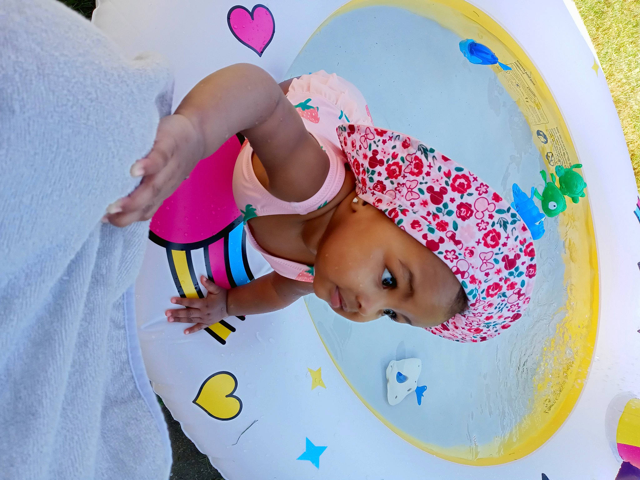 Ariyah is registered to the contest to win money with this photo: art, baby, baby_products, baby_toddler_clothing, cap, child, circle, fashion_accessory, fun, happy, hat, headwear, linens, magenta, pattern, person, pink, play, sleeve, sun_hat